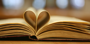 Book pages folded to form a heart